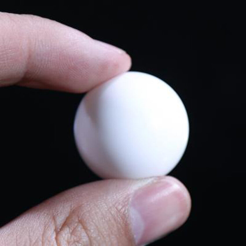 Close-up of PTFE seal balls—ideal for diaphragm pumps, white color, Ø3-63mm size range