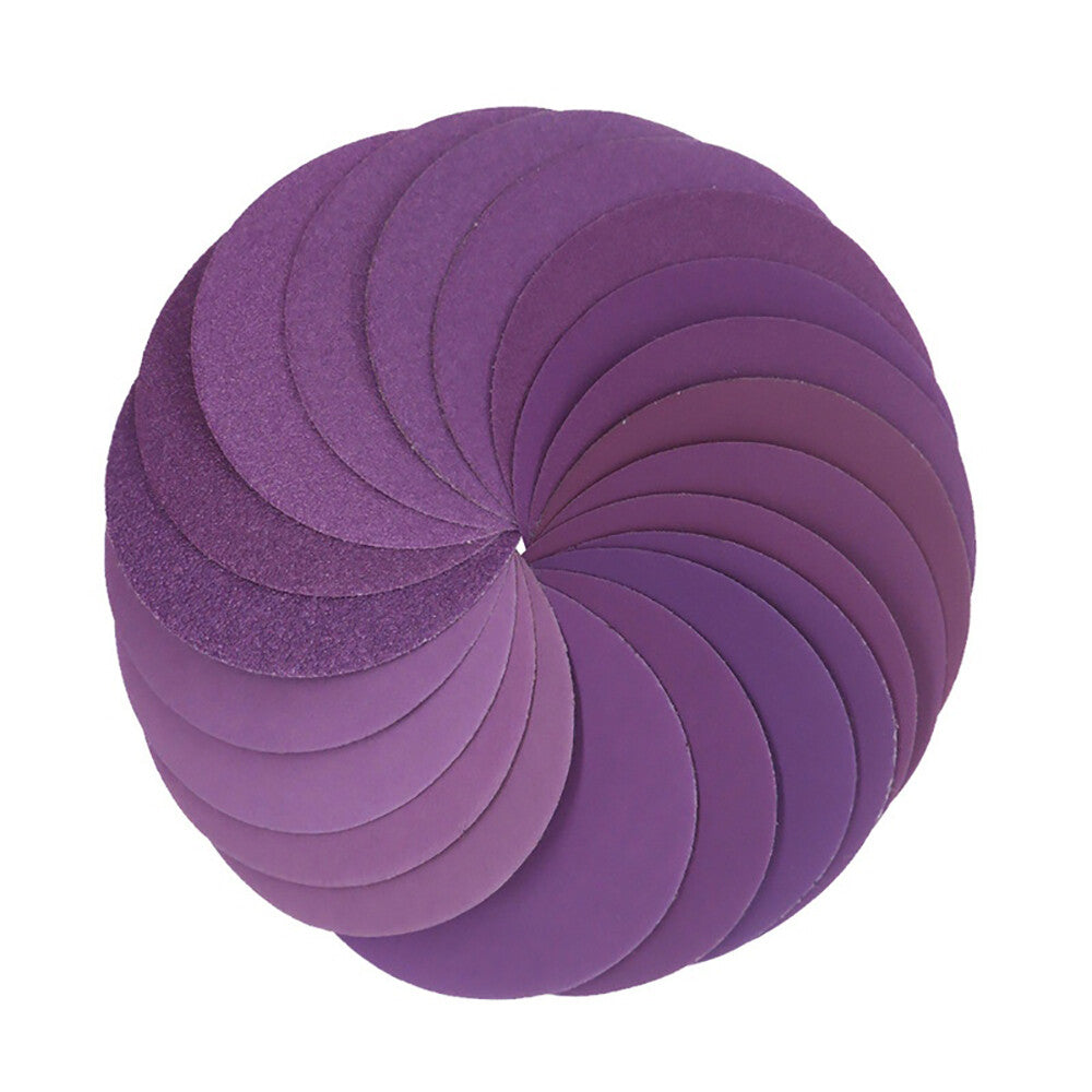 4-inch 100mm waterproof sanding disc held in a hand, showing scale and the vibrant purple abrasive surface.