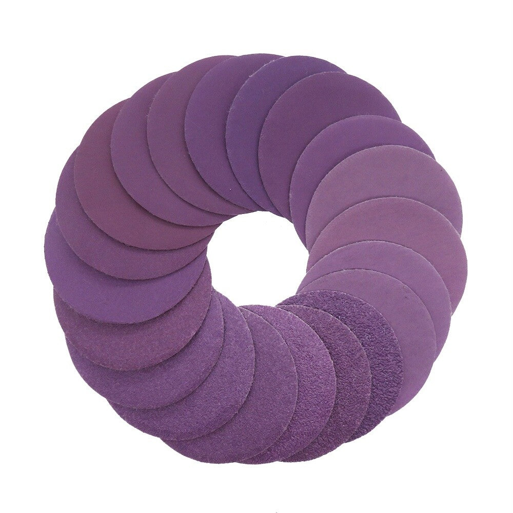 Close-up of a 2-inch purple wet and dry sanding disc with a high grit rating.