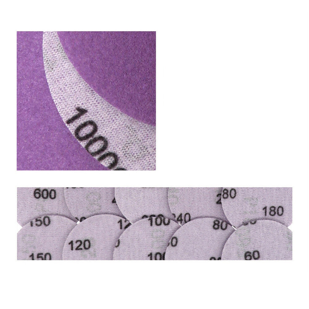 Assortment of purple sanding discs with different grits for HomeDIYers.