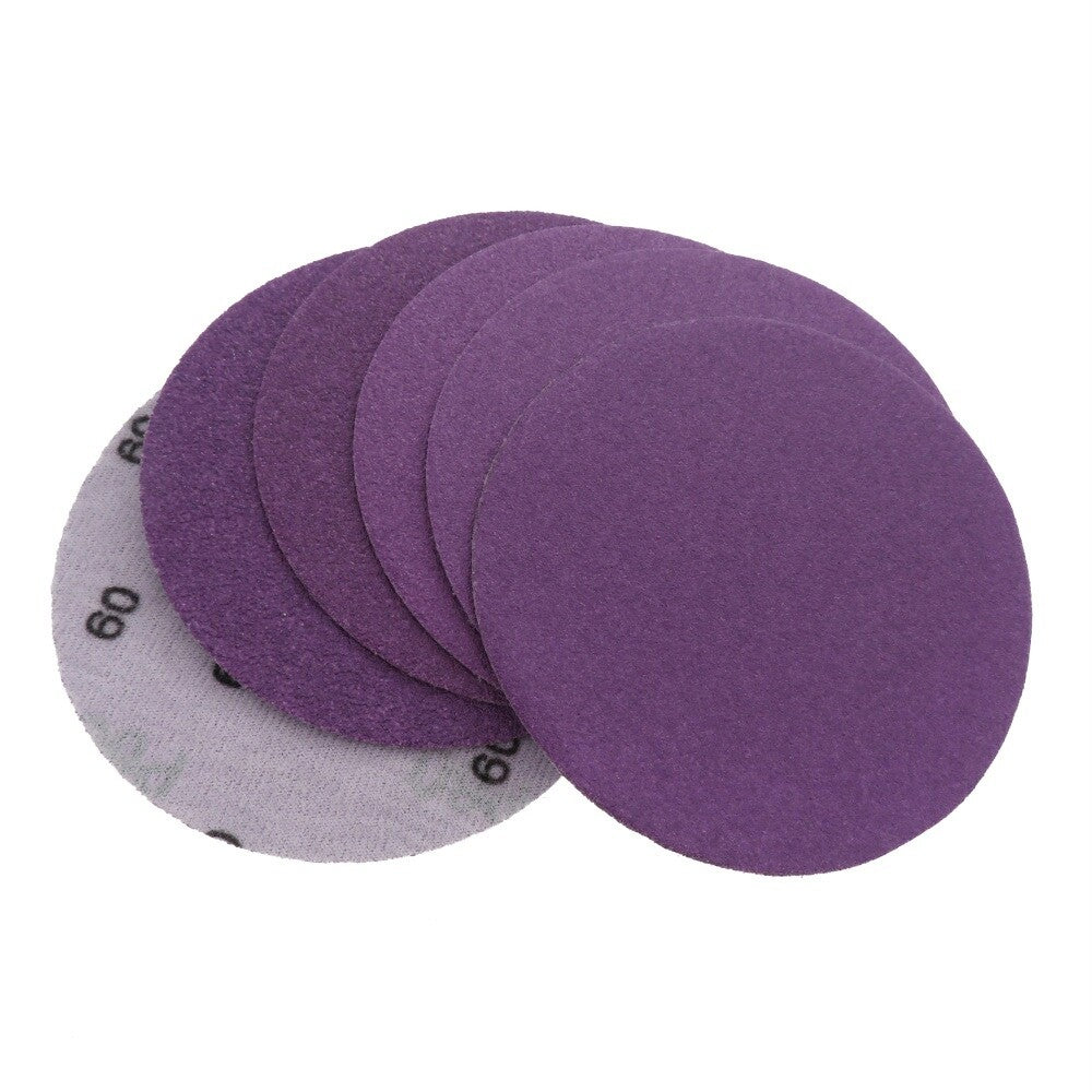 Package of 4-inch purple sanding discs with clear grit label, showcasing the product range from coarse to ultra-fine.