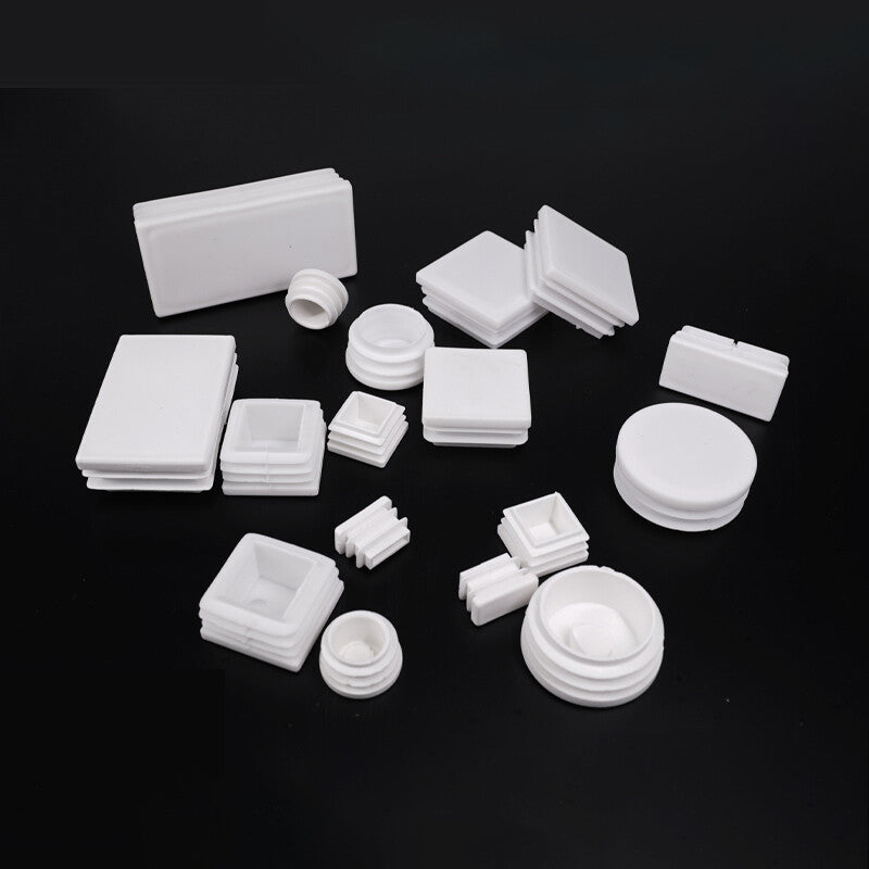 Square plastic end cap installed on metal tubing for furniture protection