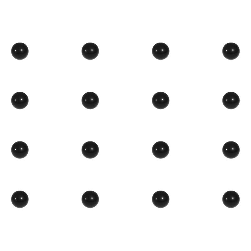 Silicon nitride balls next to steel balls in a corrosive environment, demonstrating rust-free advantage
