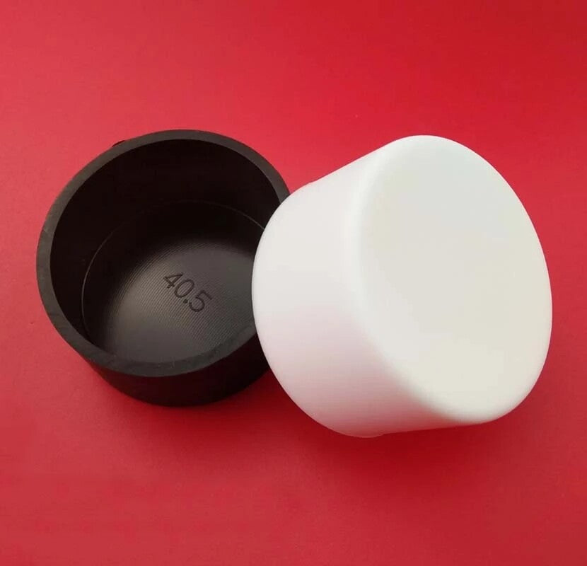 Installation demonstration of white end cover cap on metal tube end