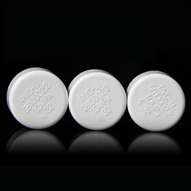 Assortment of white PVC end caps in multiple sizes from 20mm to 200mm
