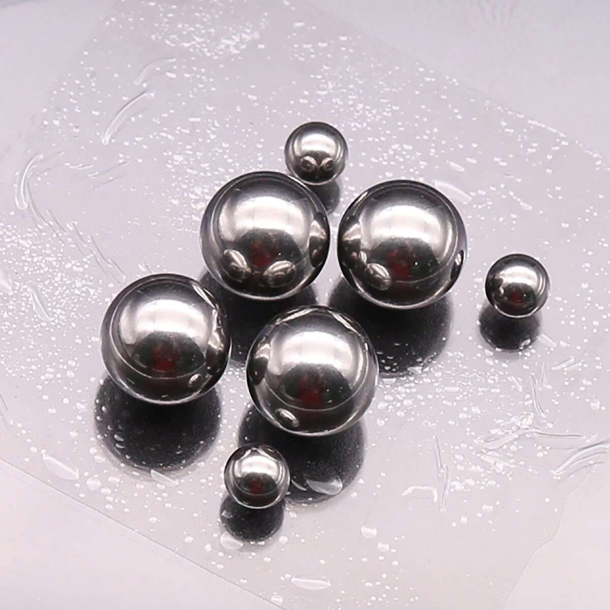 Extreme close-up macro of a 5mm ball showing mirror-like smooth finish