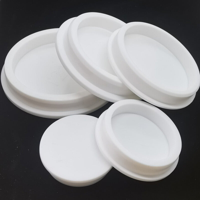 Close-up detail of silicone rubber hole plug showing flexible material and sealing edge