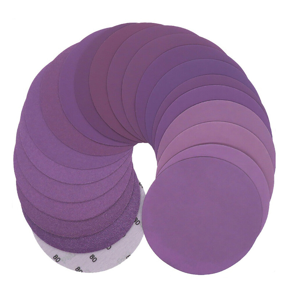 Close-up of purple waterproof sanding disc showing abrasive surface texture