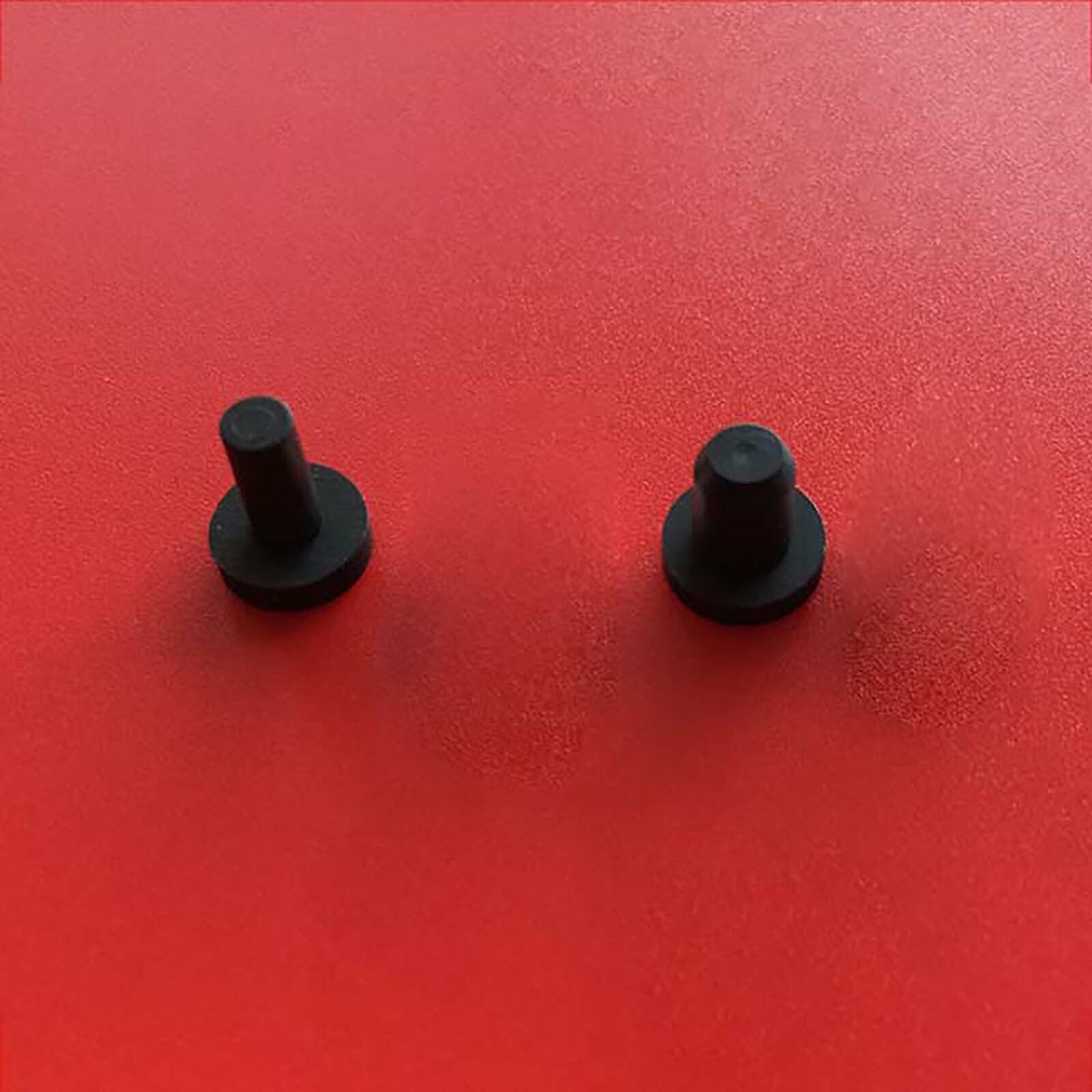 Close-up of silicone blanking end cap showing flexible tube seal plug design