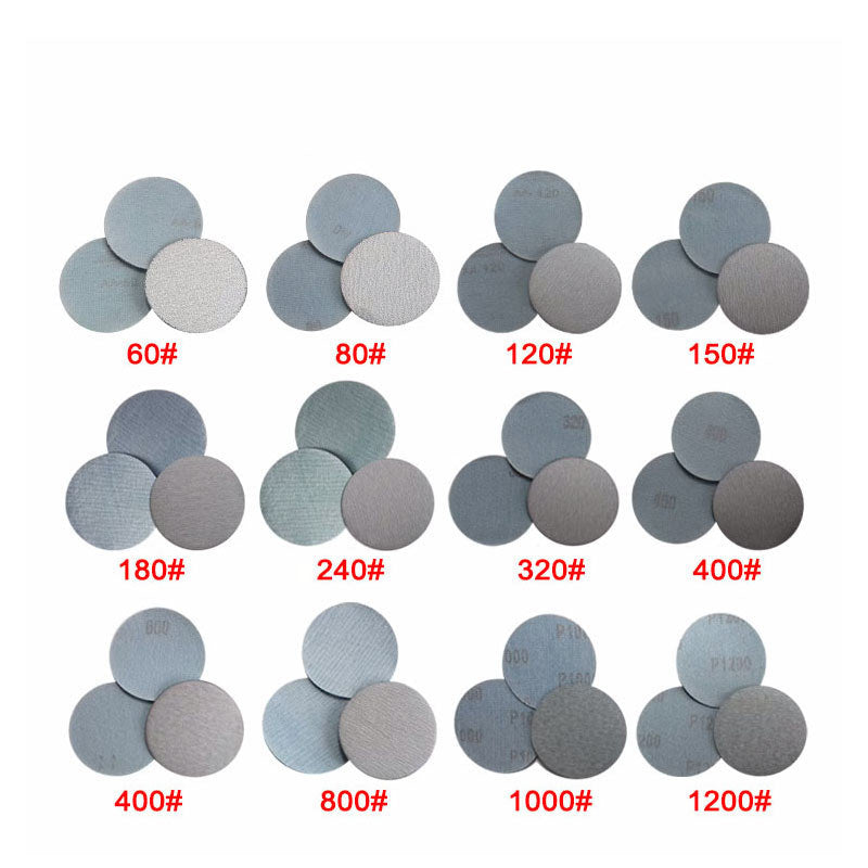 Assortment of 75mm dry sanding discs showing a range of grits from coarse P60 to fine P1200.
