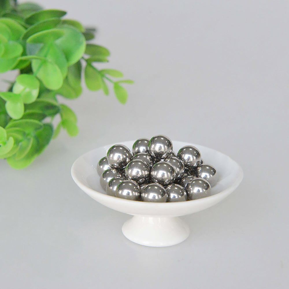 Carbon steel balls used as bearings in a simple pulley or gear mechanism