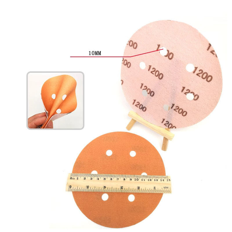 Back side of 6-inch sanding disc showing the sturdy hook and loop backing system.