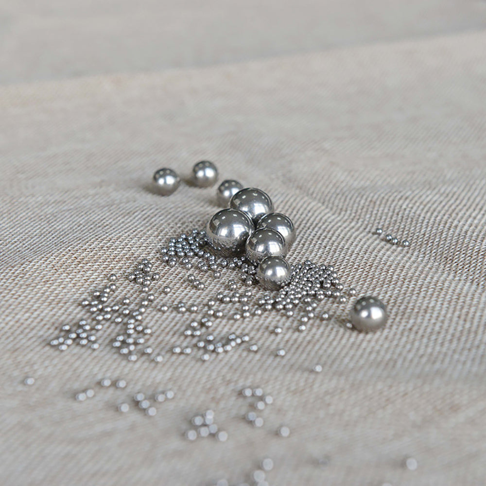 Carbon steel ball being welded to a metal surface in a DIY fabrication project