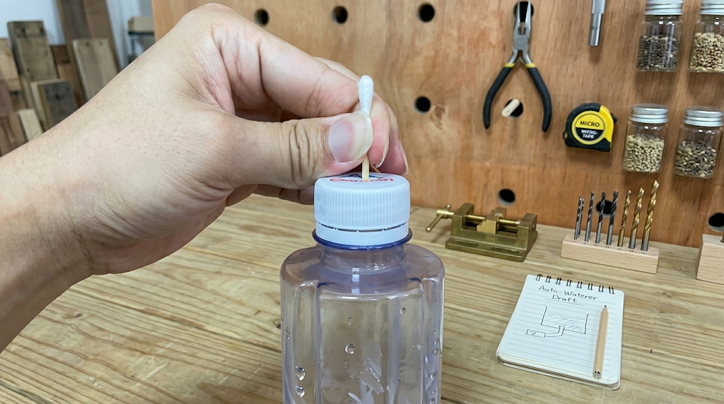 DIY self watering bottle maker with cotton swab drip cap