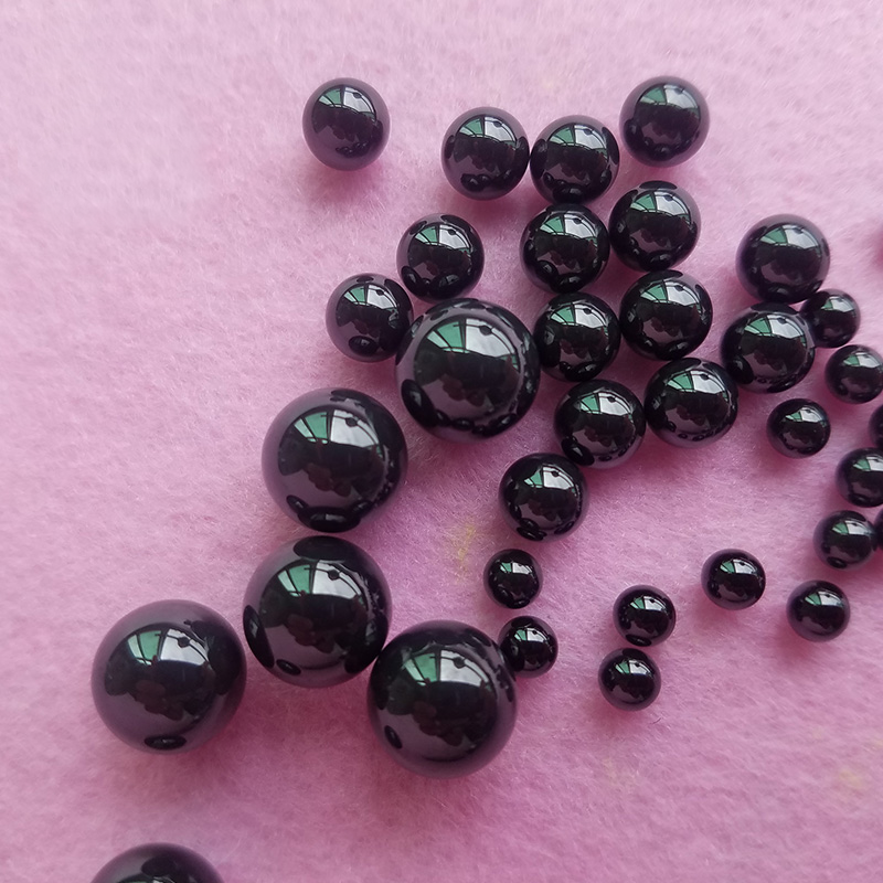 Size comparison of G5 Si3N4 ceramic balls from 0.8mm to 5.953mm, displaying the full range of available high-precision Silicon Nitride bearing balls.