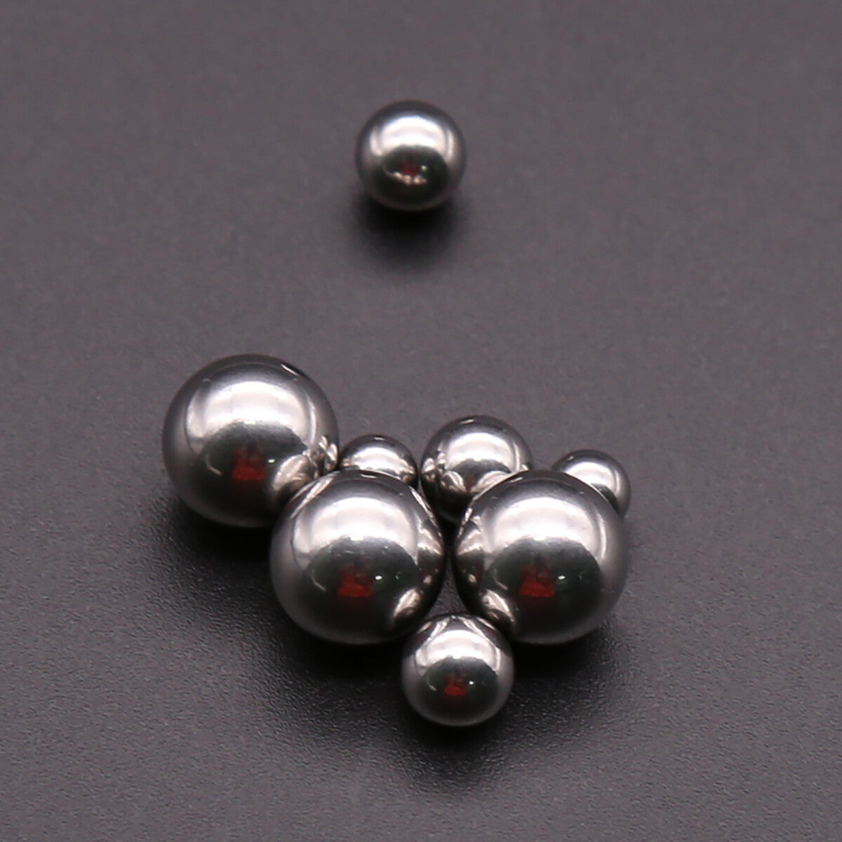 Multiple G10 chrome steel balls (1mm~9.525mm) displayed, bike bearing replacement parts