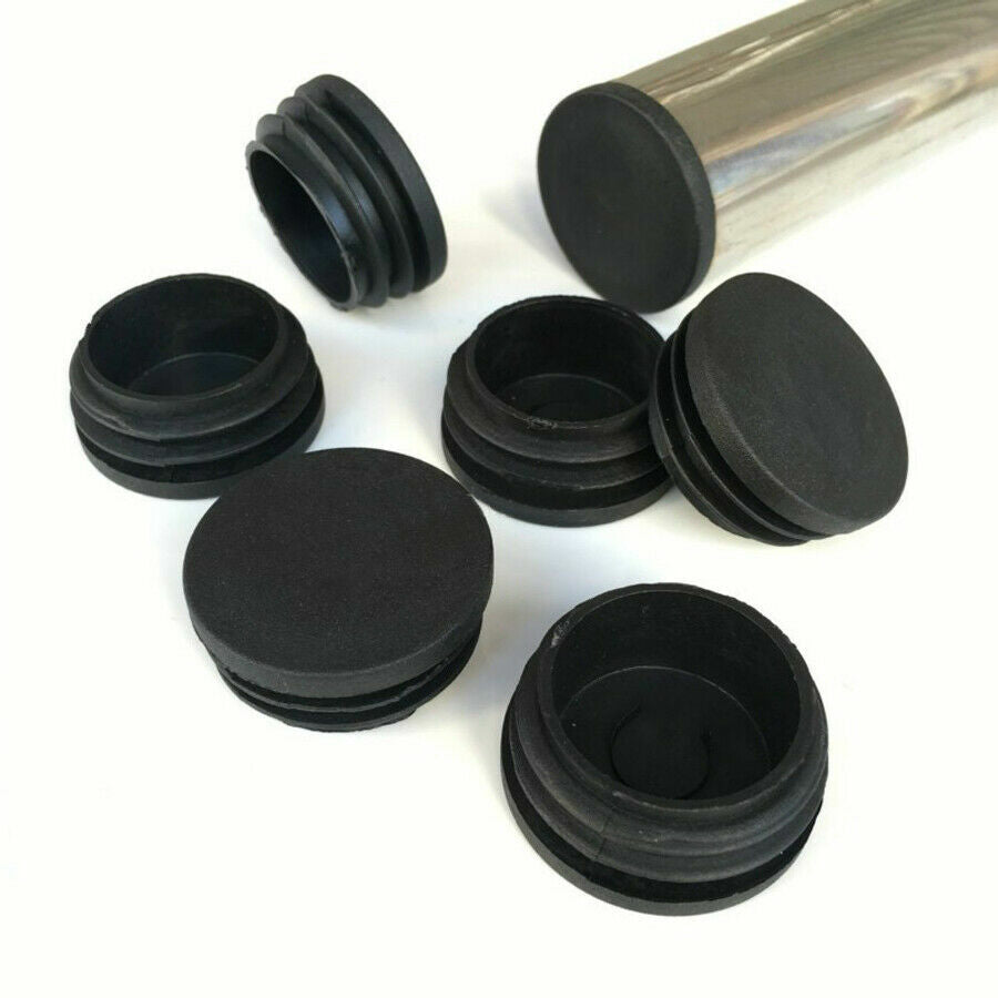 Black end caps protecting tubing ends on industrial machinery