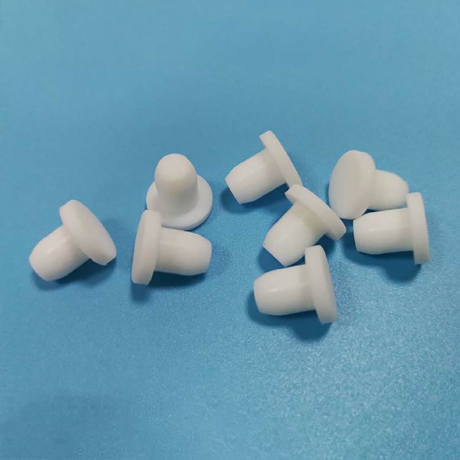 Size comparison chart for white silicone end caps from 9mm to 19mm diameters