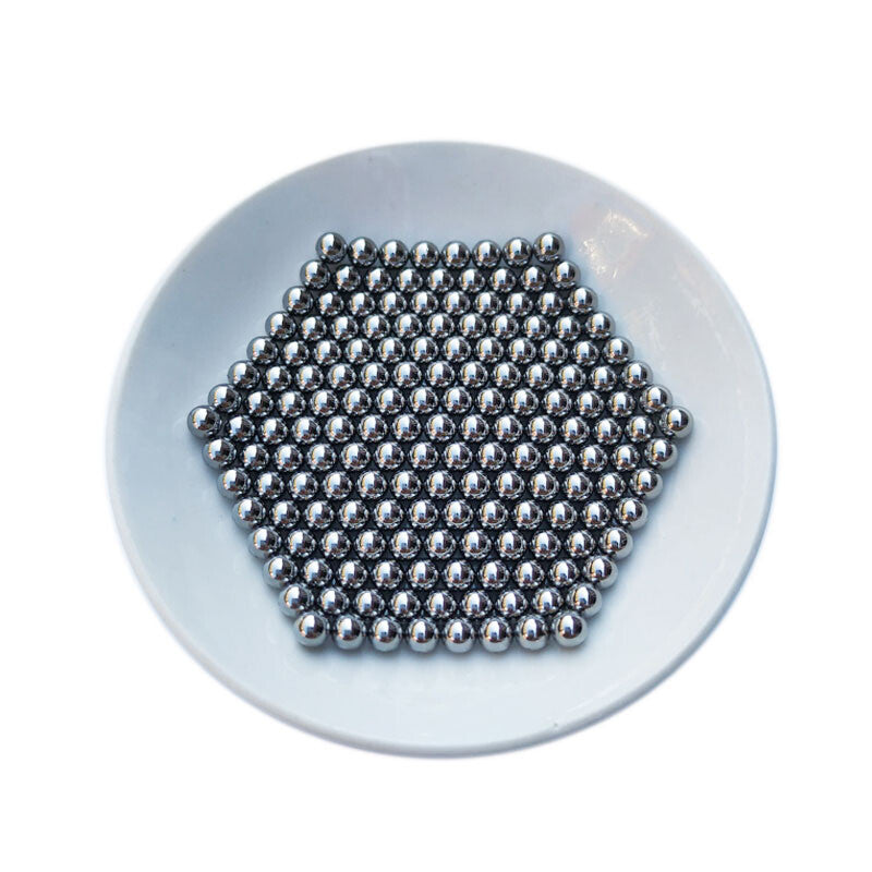 Steel balls aligned in a row by size from 1mm to 3.2mm for clear comparison