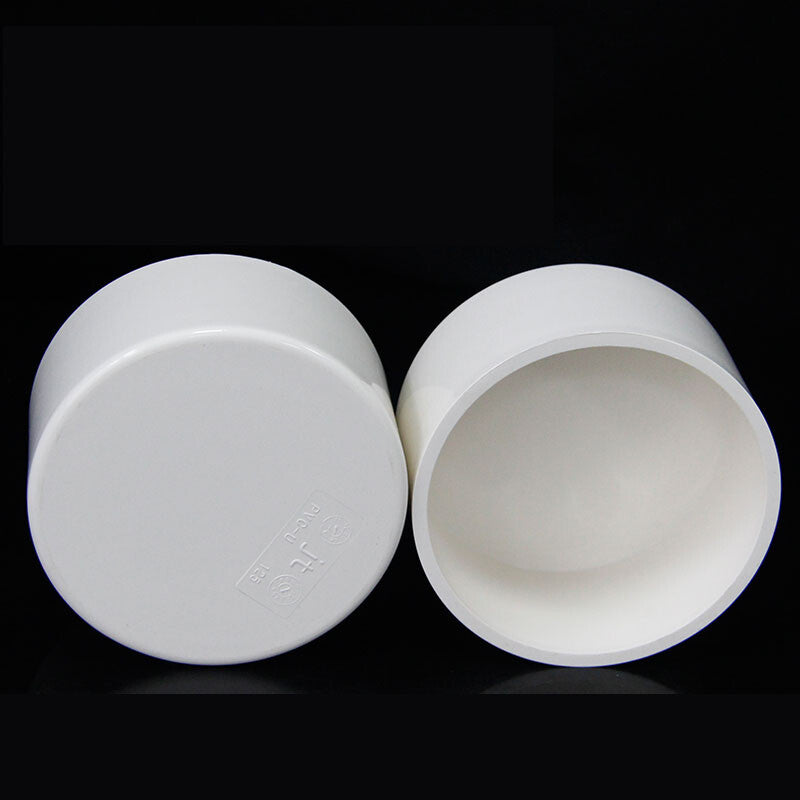 PVC end cap installed on drain pipe demonstrating secure adhesive fit