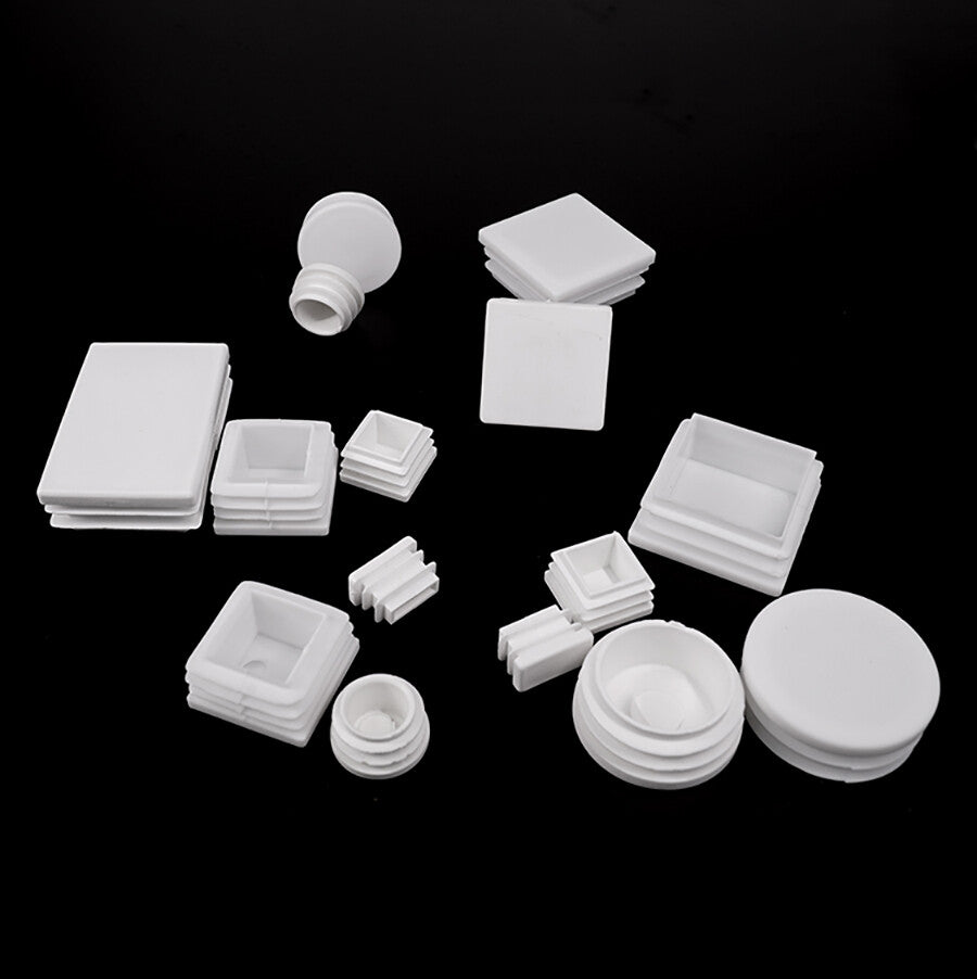 Square end caps protecting tubing on outdoor railing system