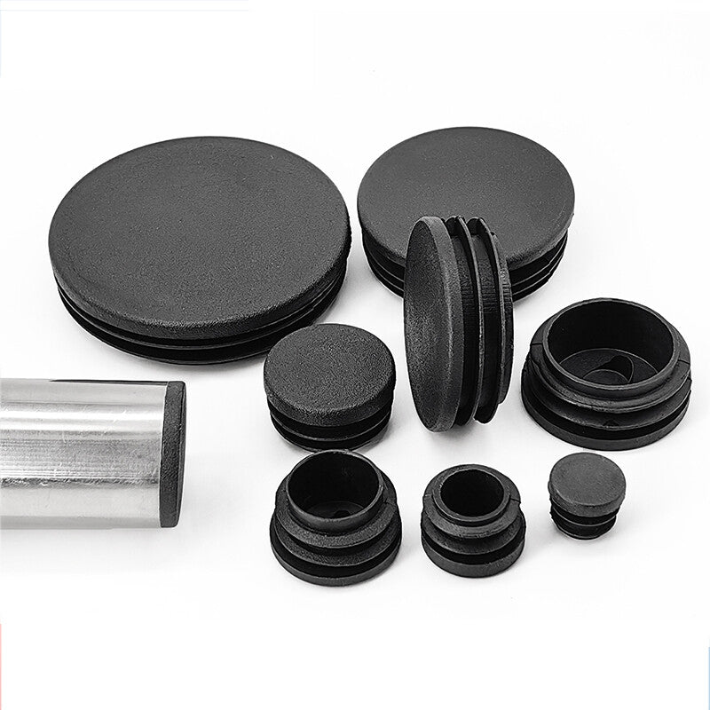 Black plastic blanking end caps showing round shape (12mm-76mm) for tube/pipe protection