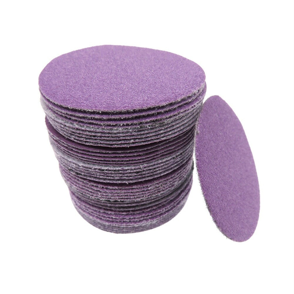 Wet sanding demonstration using a purple 50mm sanding disc.