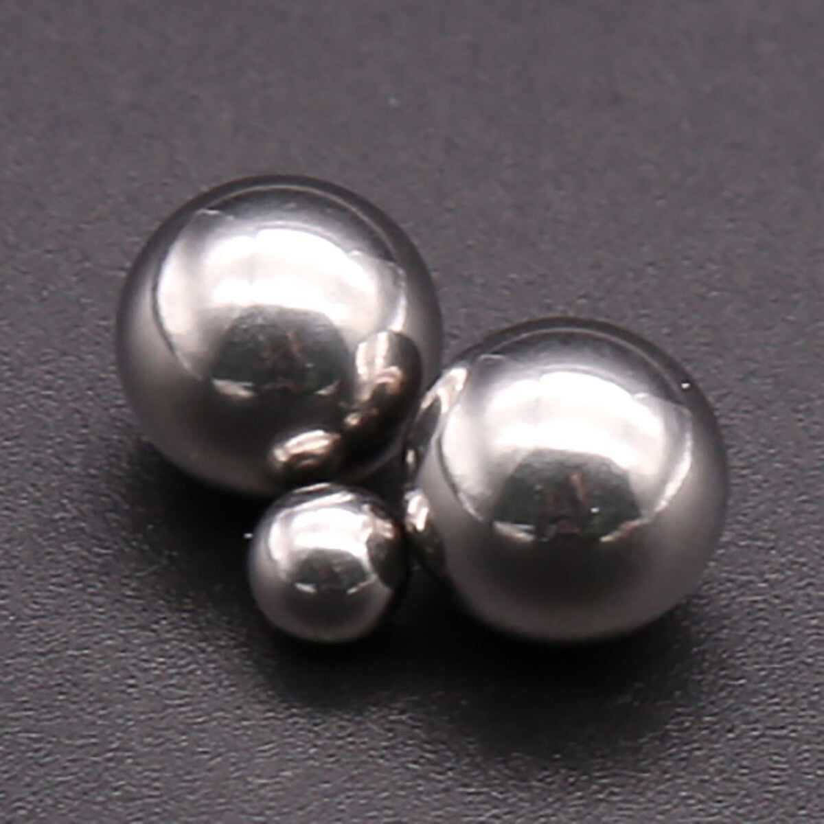 Close-up of chrome steel bearing balls—G10 precision, 1-9.525mm, ideal for bike repairs