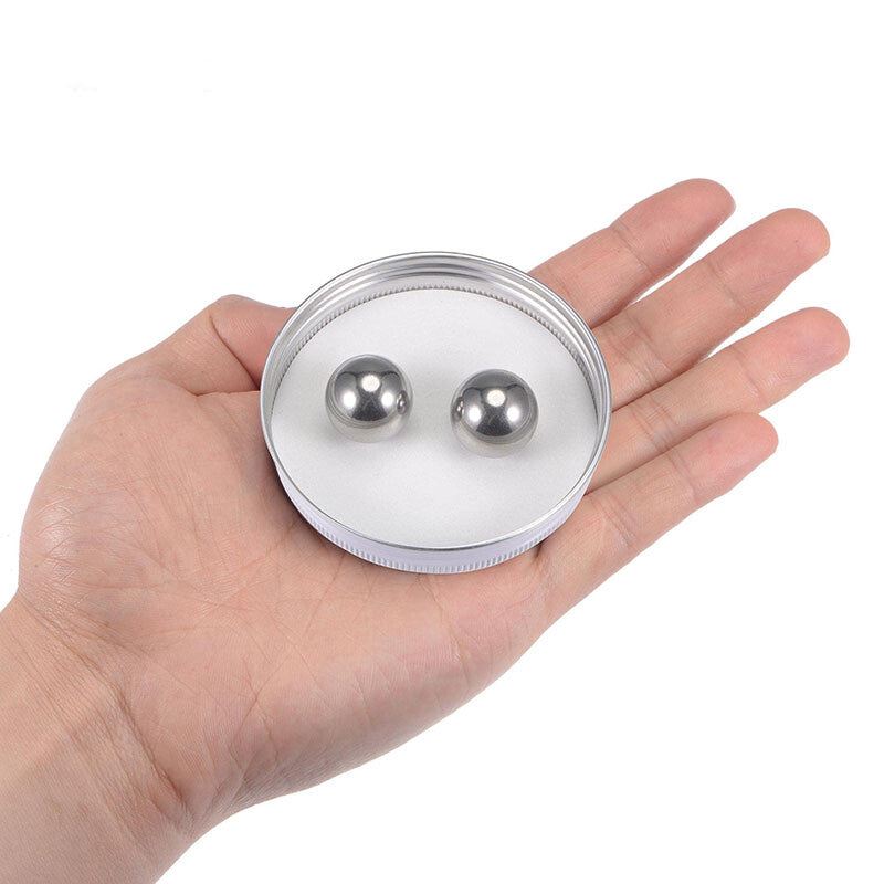 Large stainless steel bead held in hand showing substantial size and industrial scale