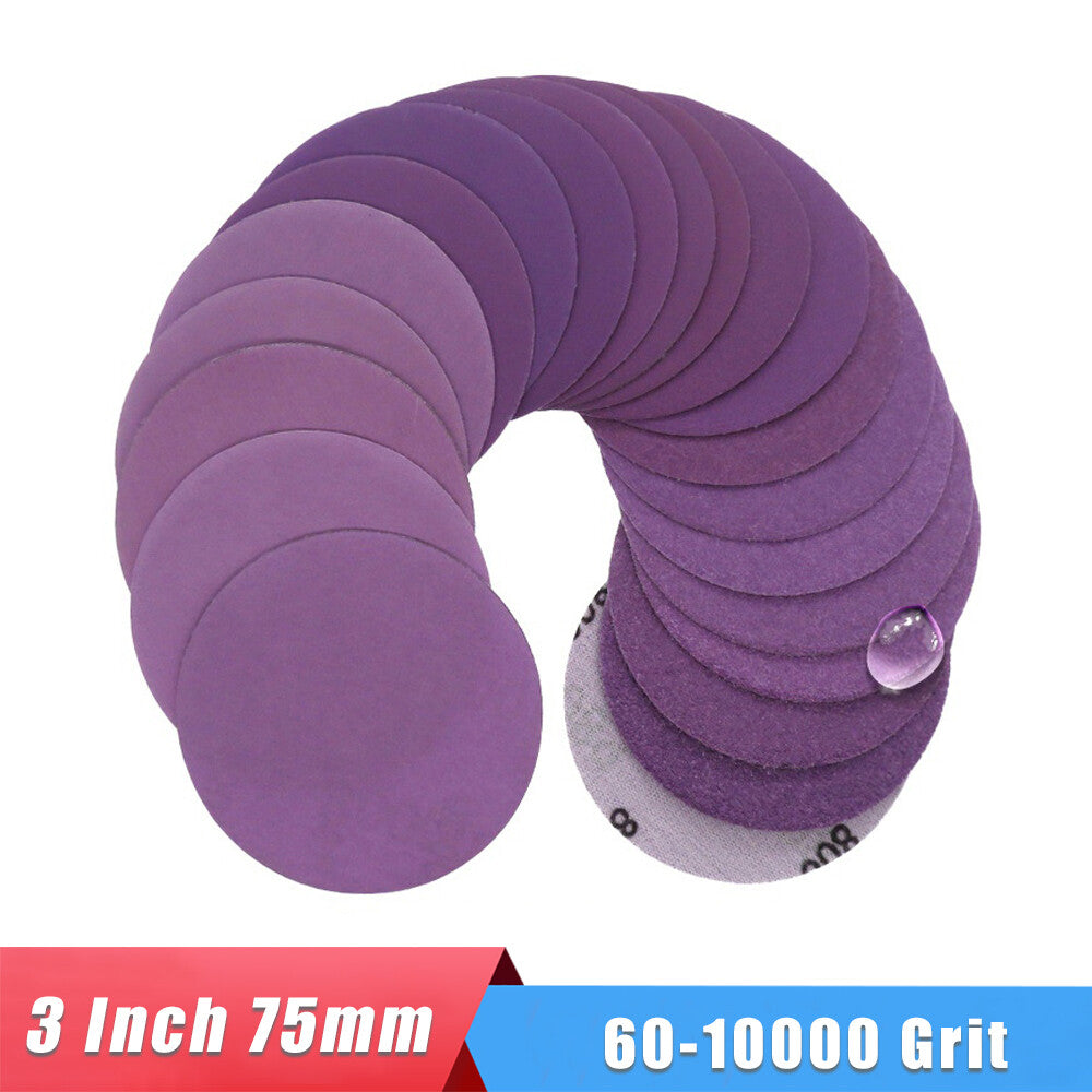 Close-up of the abrasive grit on a purple 3-inch wet and dry sanding disc.