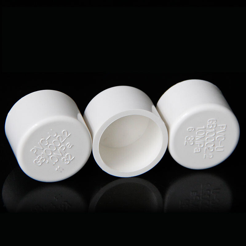 Size comparison chart for PVC pipe caps showing diameter range 20-200mm
