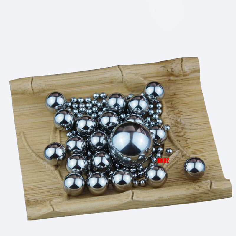 Balls undergoing a hardness test (Rockwell C scale) in a lab setting