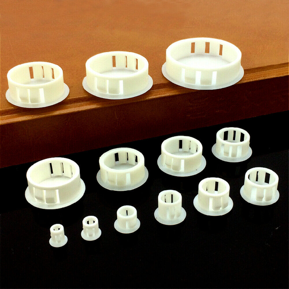 Black end caps protecting tubing ends on industrial equipment