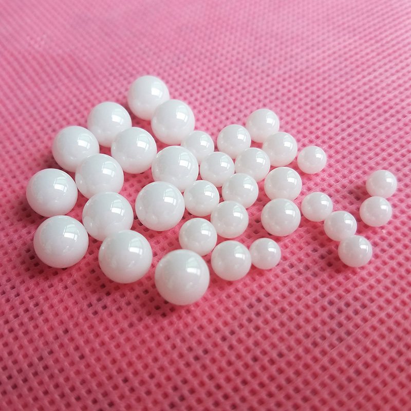 Side-by-side comparison showing the size difference between 11mm and 15.87mm balls
