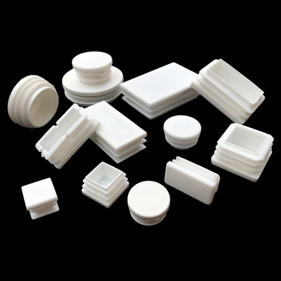 Assortment of white square and rectangular plastic end caps in multiple sizes