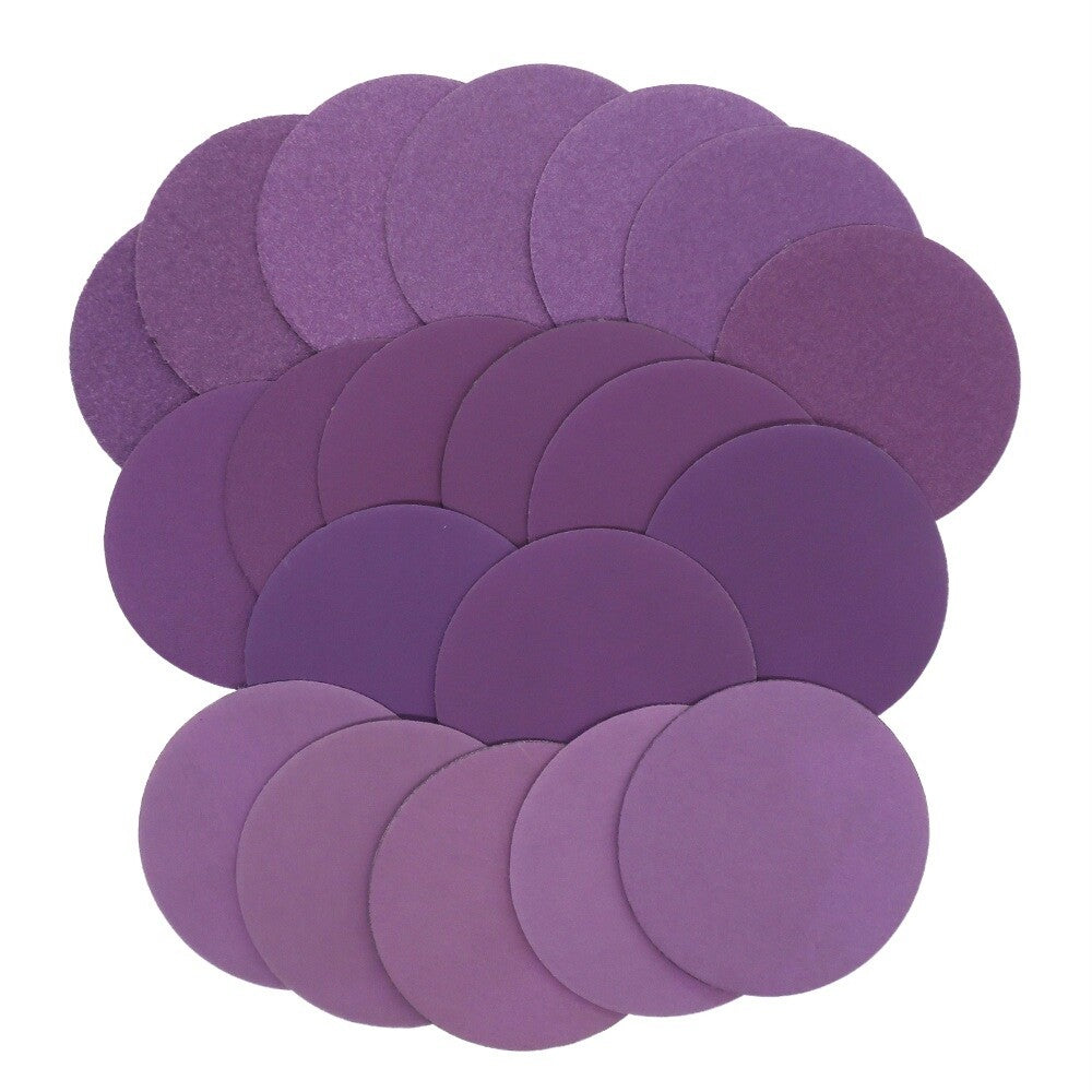 Backside (hook and loop) of the purple sanding disc for easy attachment to tools.