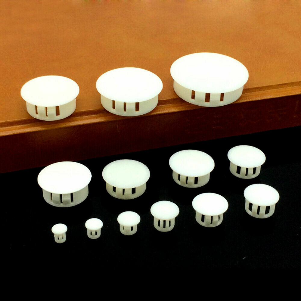 White plastic end cap installed on display shelf tubing