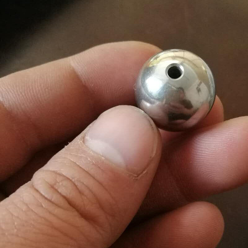 Close-up of through hole on stainless steel beading round balls