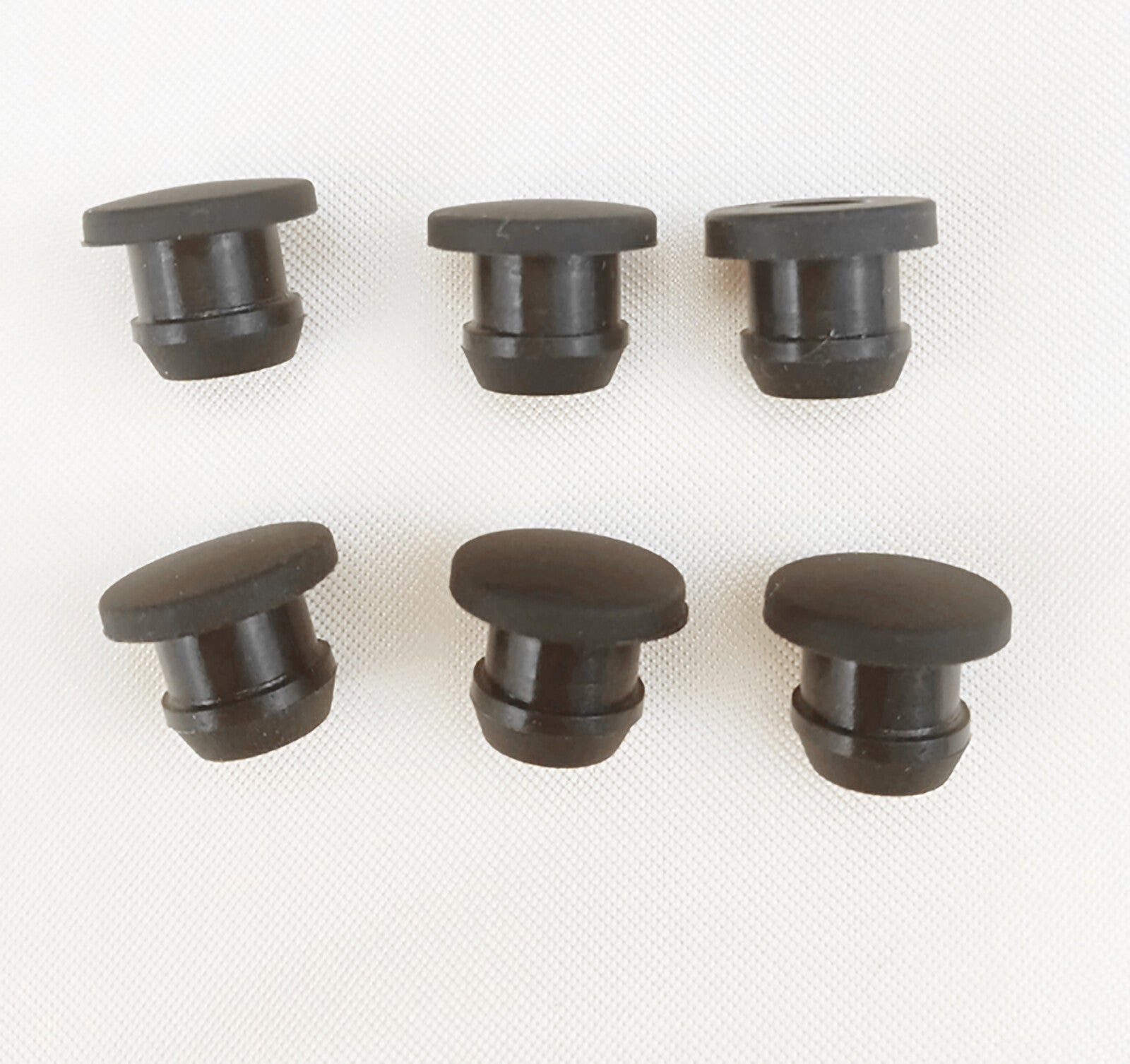 Installation demonstration showing snap-on plug inserted into panel hole