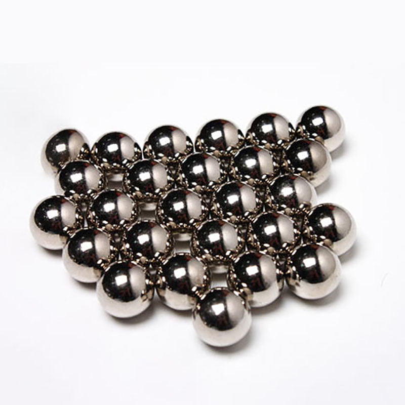 Multiple chrome steel balls arranged in a row, highlighting consistency in size and finish