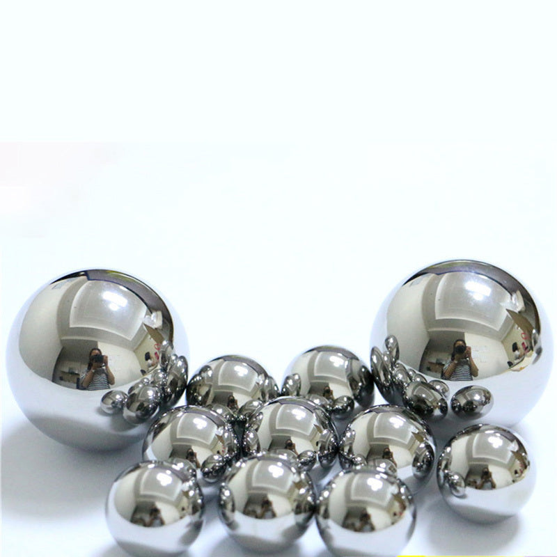 Size comparison of different diameter steel balls from 2mm to 31.75mm on a ruler