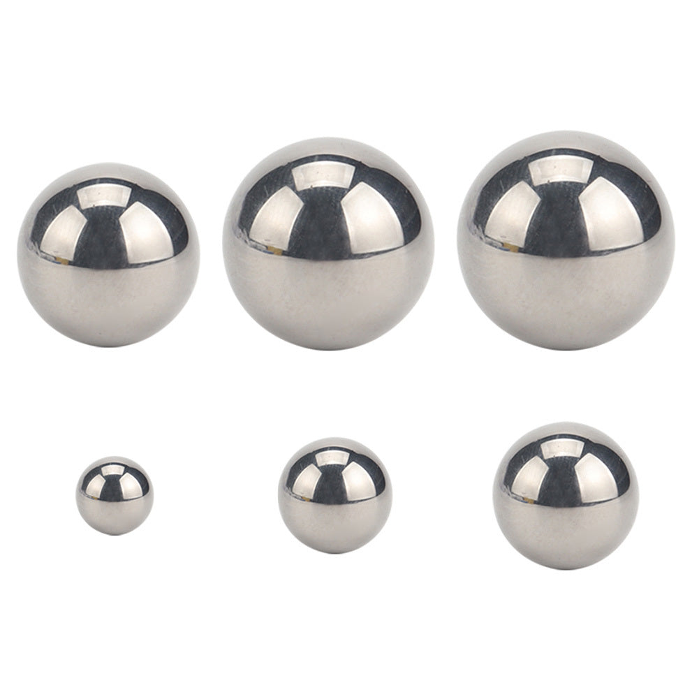 Loading Durable Chrome Steel Balls into a Slingshot for Target Practice